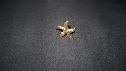 Bague dorée ajustable avec une étoile de mer