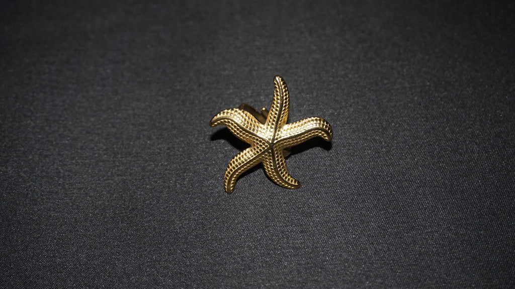 Bague dorée ajustable avec une étoile de mer